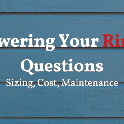 A Rinnai tankless water heater mounted on exterior wall with white text.