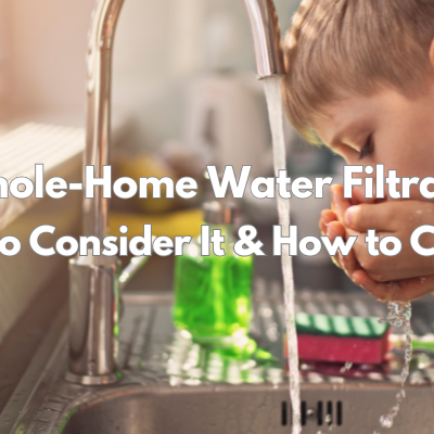 Whole-Home Water Filtration a boy cupping water out of a kitchen faucet
