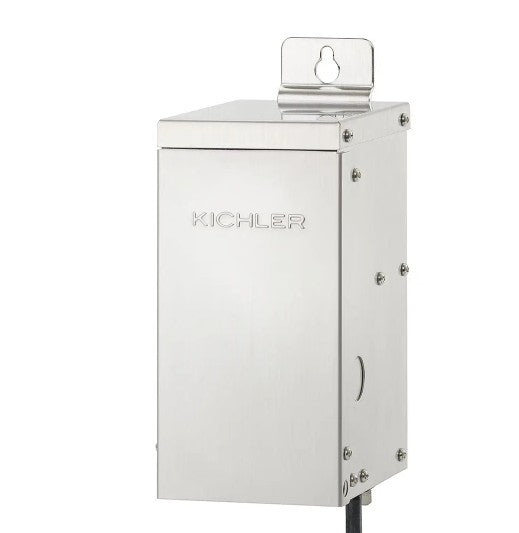 A stainless steel electrical enclosure box with the Kichler brand name embossed on the front, featuring a mounting bracket on top and a black cable entering from the bottom, set against a plain white background.