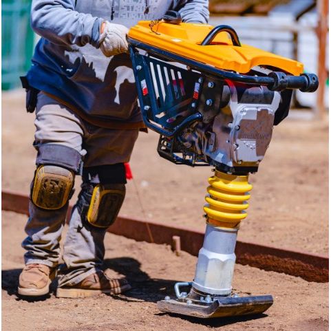 Tomahawk Power JX60H jumping jack tamper showing Honda engine, handle, and compacting shoe