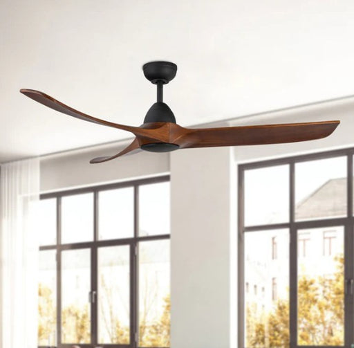 Ceiling fan with wooden blades in a room with large windows