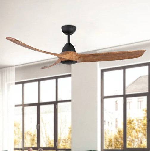 Ceiling fan with wooden blades in a room with large windows