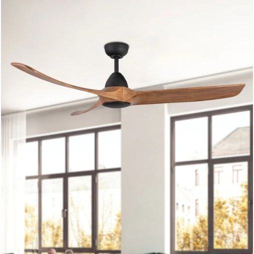 Ceiling fan with wooden blades in a room with large windows