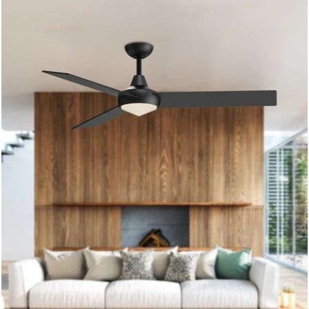 Modern black ceiling fan in a living room with a white sofa and wooden wall.