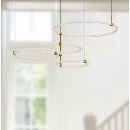 Modern pendant light fixture with circular design on a neutral background