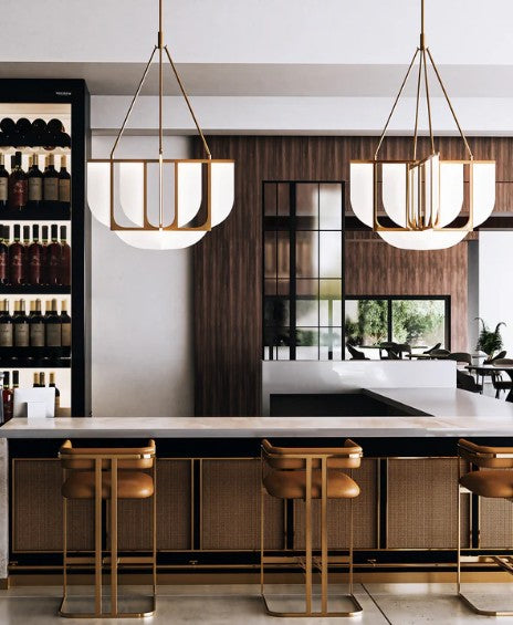 Modern kitchen with pendant lights, bar stools, and a wine rack.