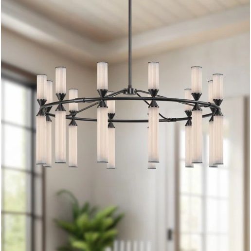 Modern chandelier with multiple lights in a room with large windows and a plant.