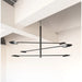 Modern black chandelier hanging from a ceiling