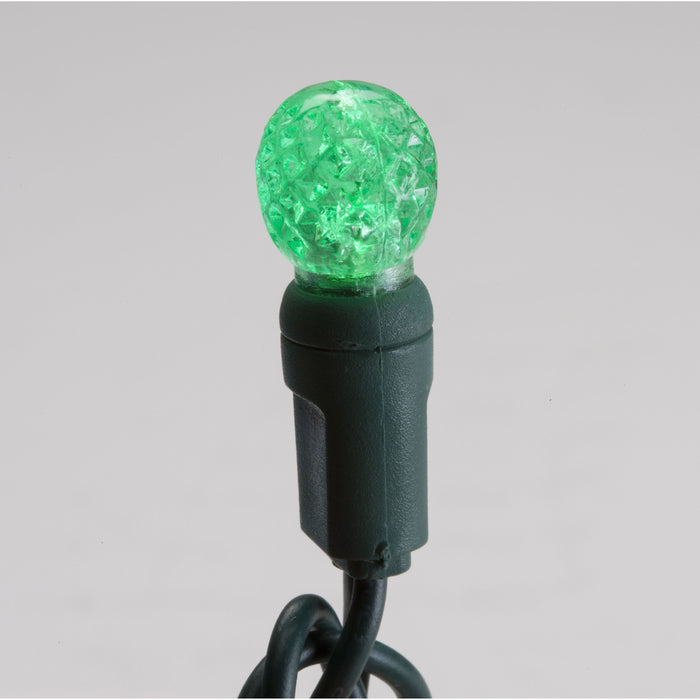 Seasonal Source 34614R-B 70 G12 Cadena de luces LED verdes, espaciado de 4" - Cable verde